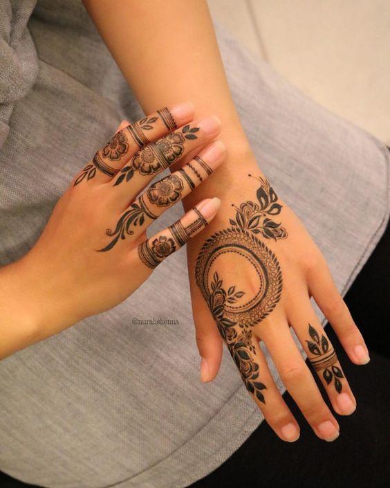 Arabic mehndi design with fingertips in bold patterns